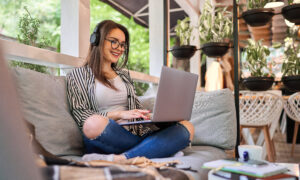 Student girl sitting at home with laptop.