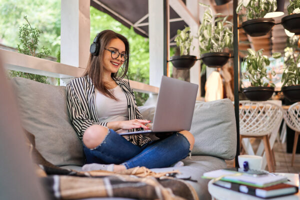 Student girl sitting at home with laptop.