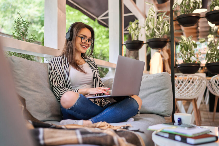 Student girl sitting at home with laptop.