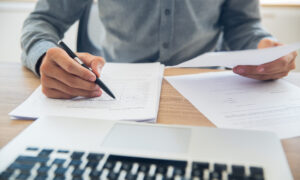 Person at desk with paperwork