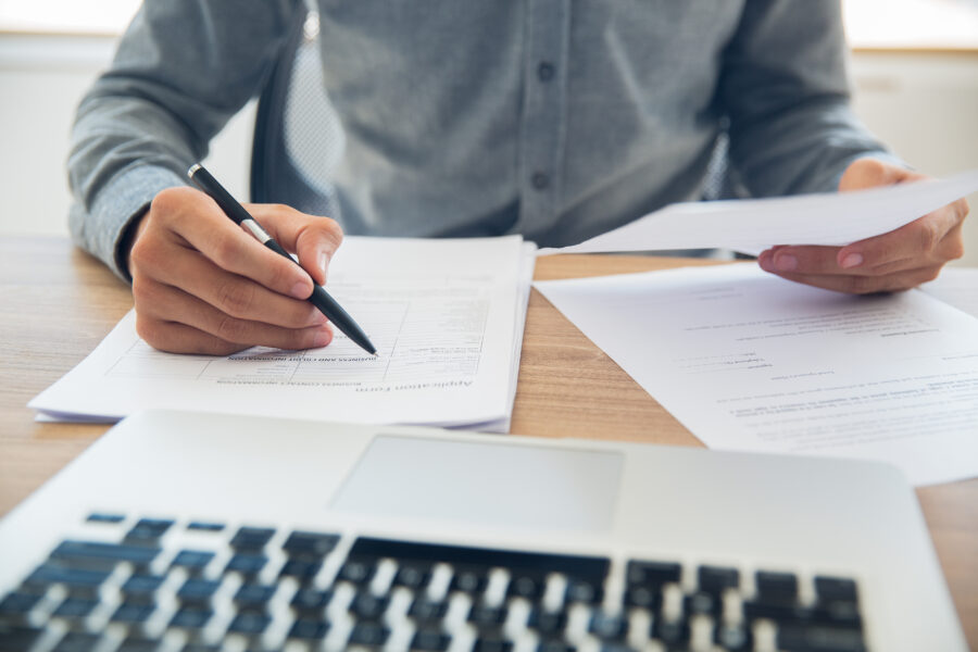 Person at desk with paperwork