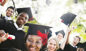 A group of students celebrating their college graduation.