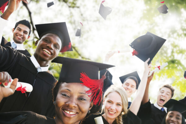 A group of students celebrating their college graduation.
